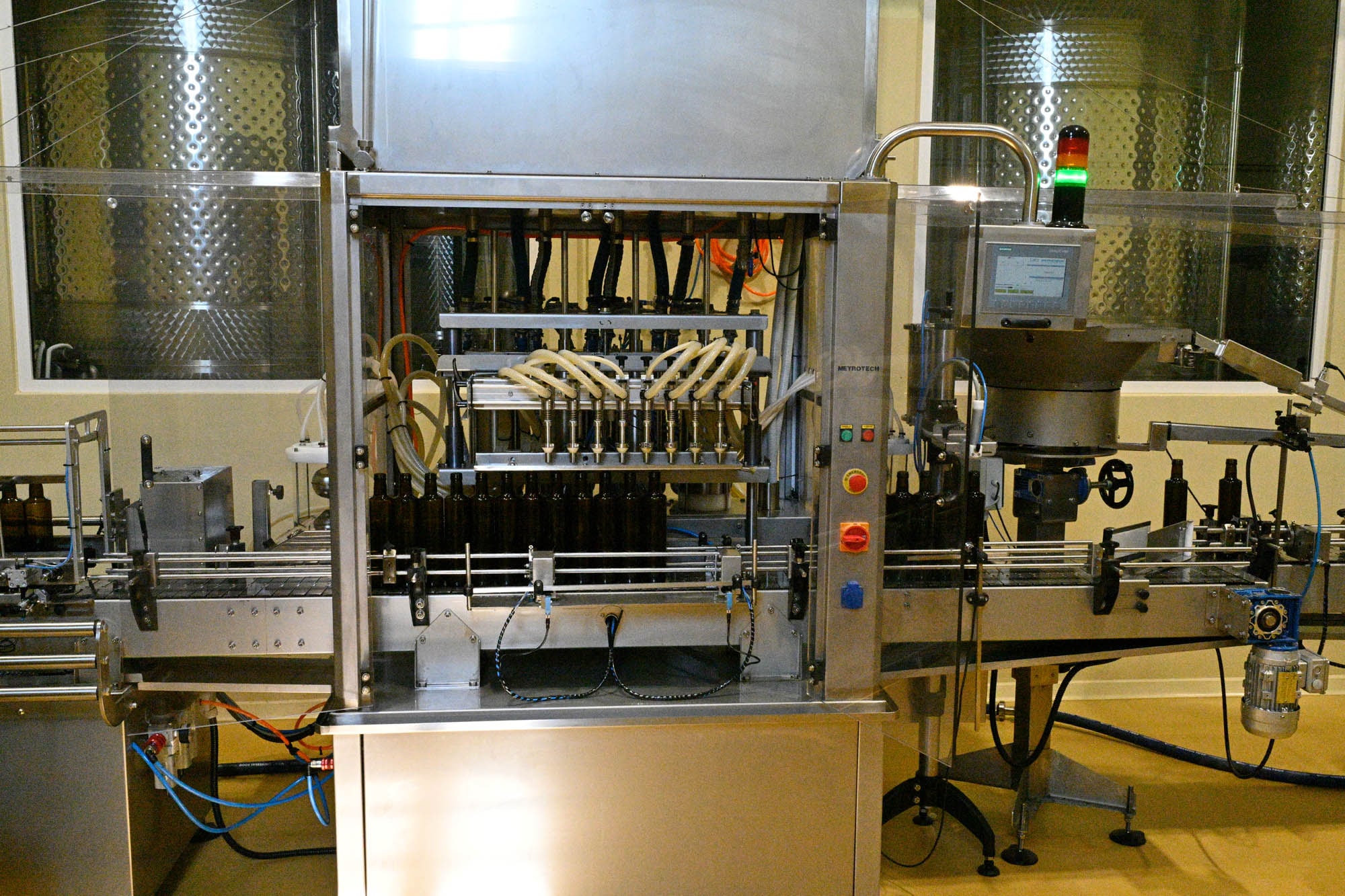 The automatic filler on the bottling line, the tanks behind
