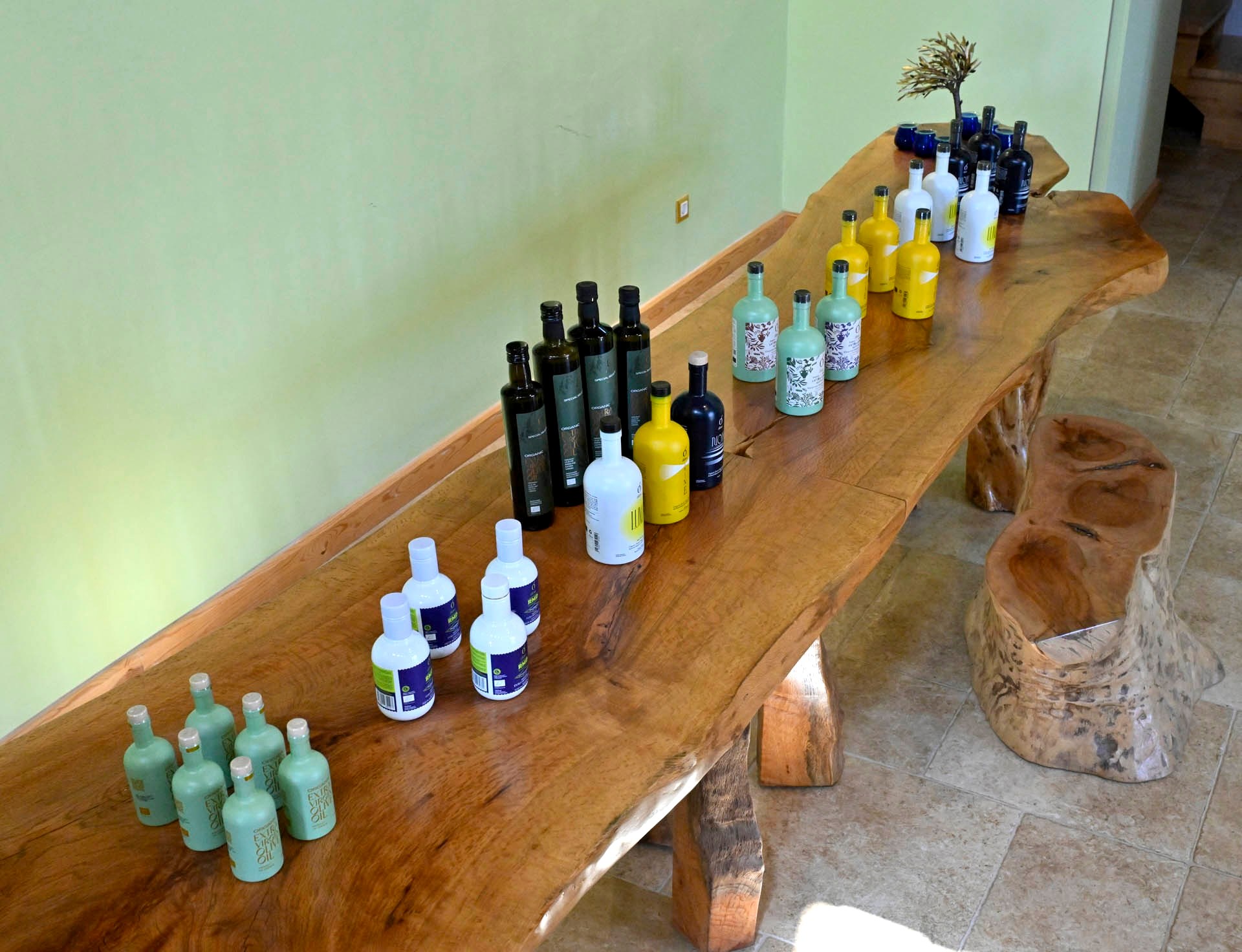 The Ol-eve range set out along the long olive-wood table