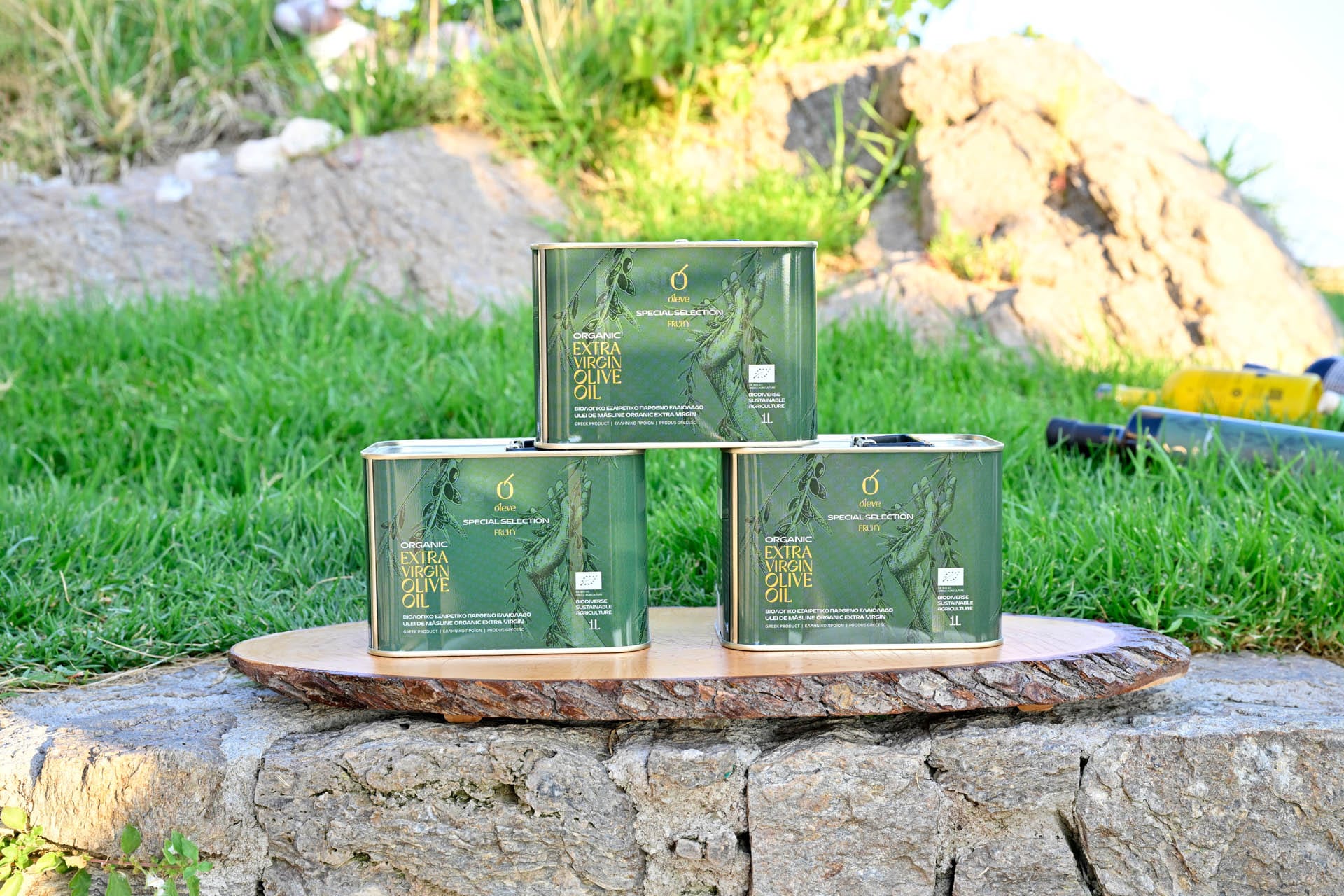 Ol-eve olive oil tins stacked on a wooden board